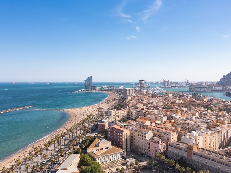 Aerial_view_of_Barceloneta_Beach_and_Port_Vell_in_Barcelona,_Spain_(51226238126)